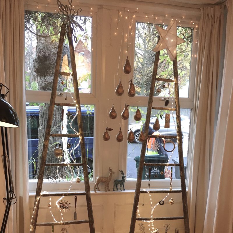 Interior window with ladders and hanging decorations 