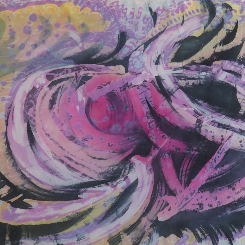 A batik with large brush strokes showing swirling waves pinks ,yellows, dark blue.                                                      dark blue. Detailed pattern work drawn with acanting.                                      d dark blue. Detailed pattern work drawn with a canting.                                                withand mauves.