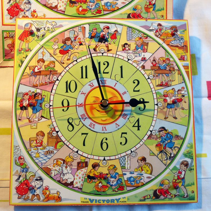 vintage wooden tell-the-time puzzle upcycled as a working wall clock
