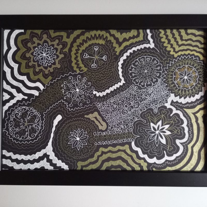 Gold, silver and white abstract drawing using gel pens on black card. Complex looking piece with spiral or cog-like shapes and sense of movement. Drawing fills the whole page.