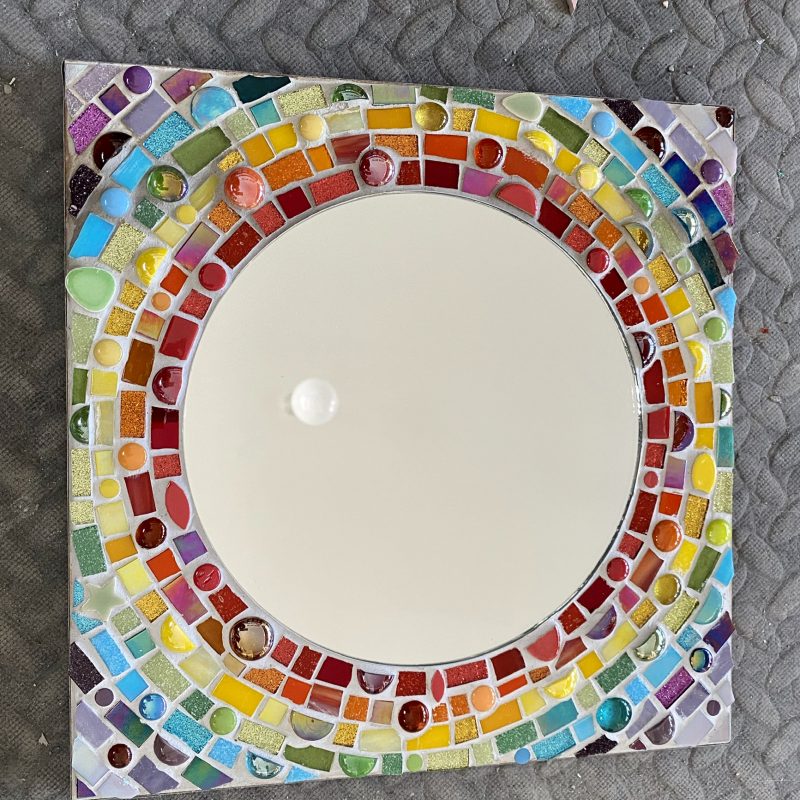 Circular mirror with mosaic rainbow surround