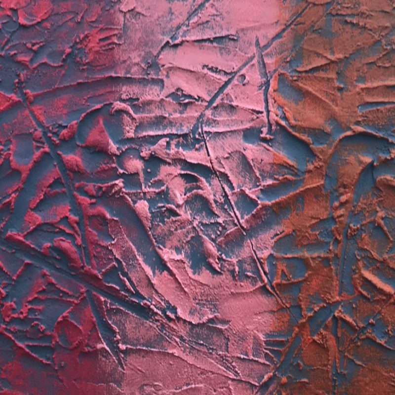 Textured abstract work featuring red, pink and purple hues