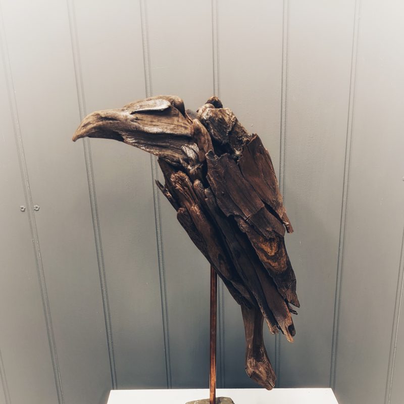 Driftwood bird sculpture on slate plinth