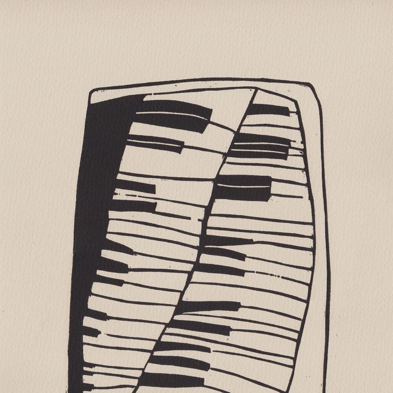 woodcut print of a piano using black ink on buff paper