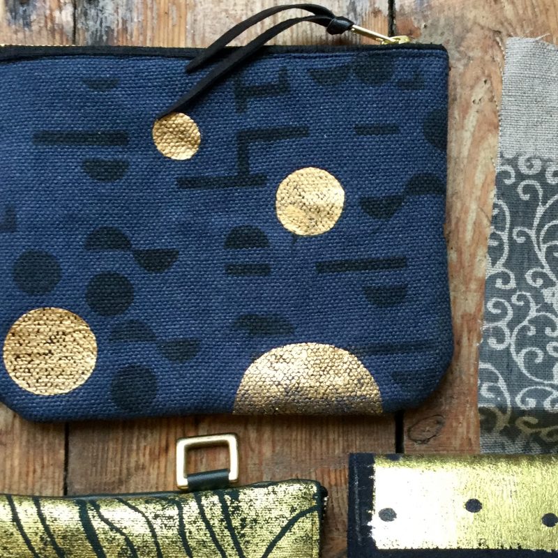 Screen and foil printed handmade blue and gold Linen Purse.   Leather wrist strap with gold buckle