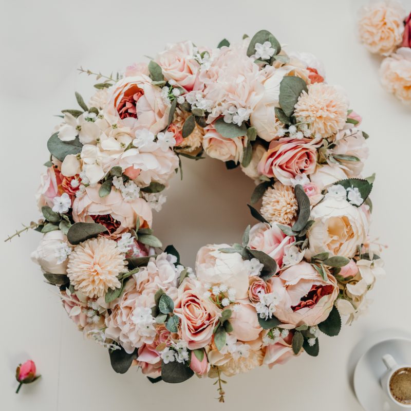 A beautiful, full and fluffy pink, pastel wreath created with pink peonies, roses, hydrangeas and eucalyptus. This wreath is perfect for hanging on the front door, as a wall hanging or as part of a table centre piece with candles. 