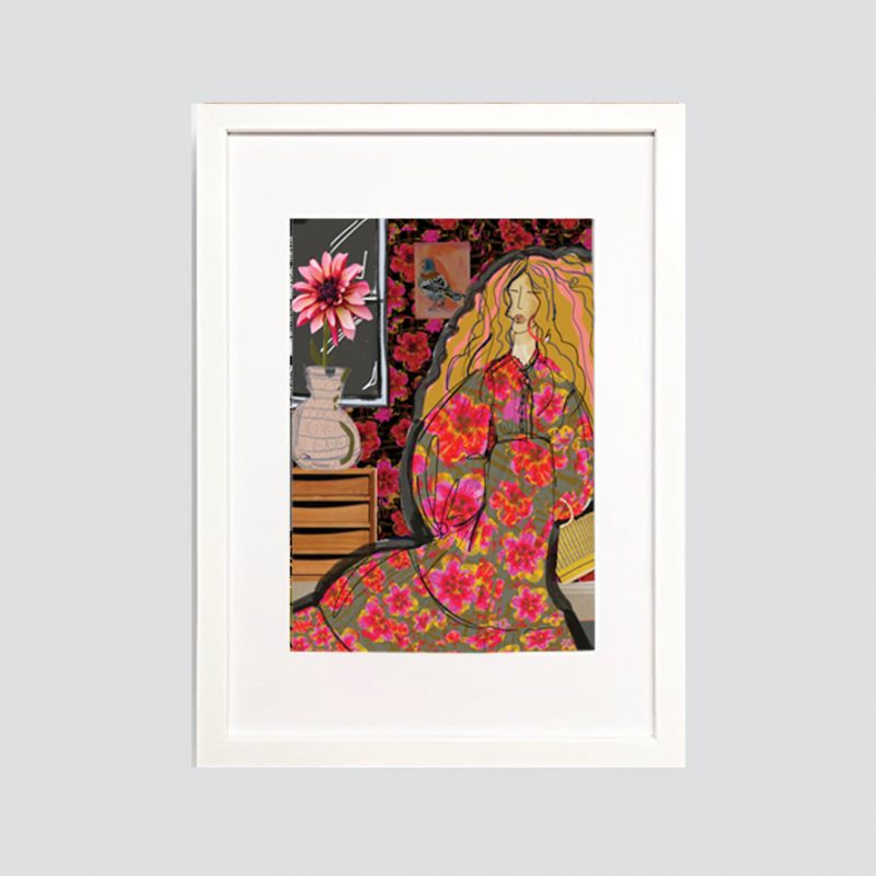 A long haired women wearing a floral print maxi in a room scene with window & mid century sideboard & vase with photographic dahlia - colours are mixes of vibrant pink tone & black,