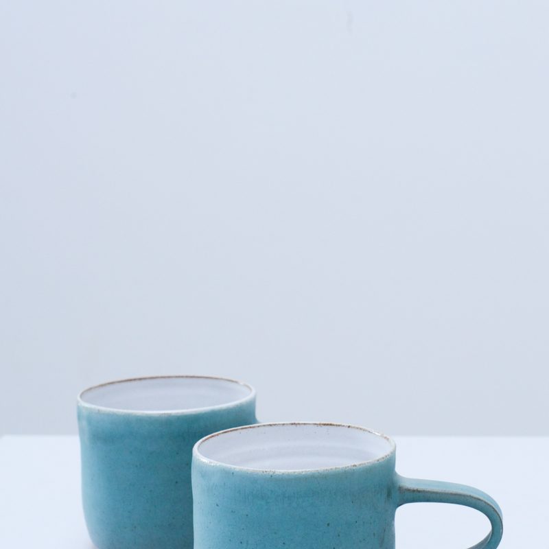 My ceramics are handcrafted using stoneware clay. They are tableware items such as plates, bowls, jugs and cups. They are finished in a mixture of white, turquoise, deep blue and black glazes. They are very tactile in their nature.
