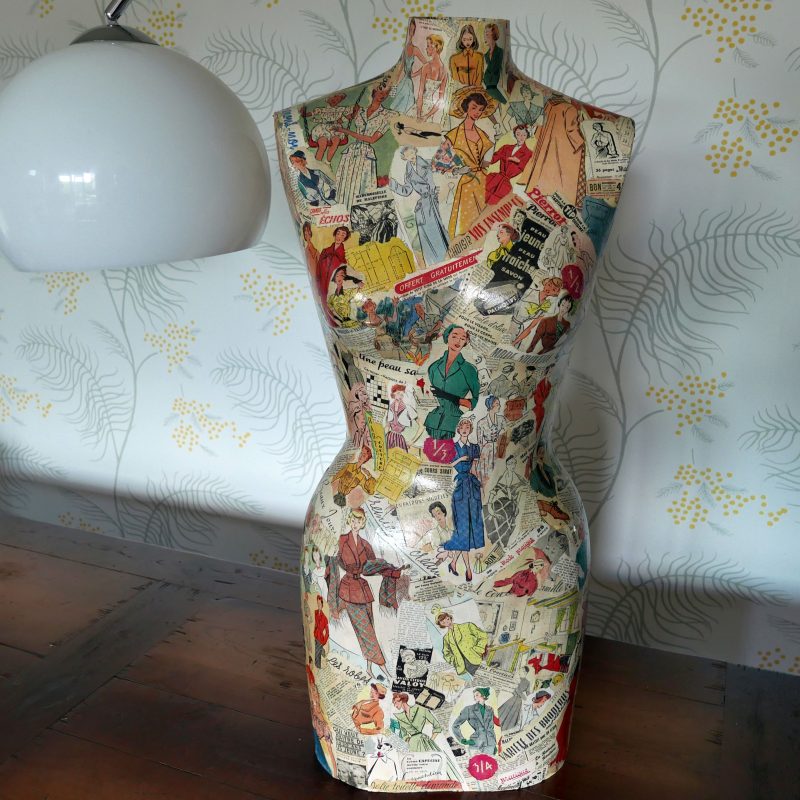 1960's mannequin covered in vintage French magazines