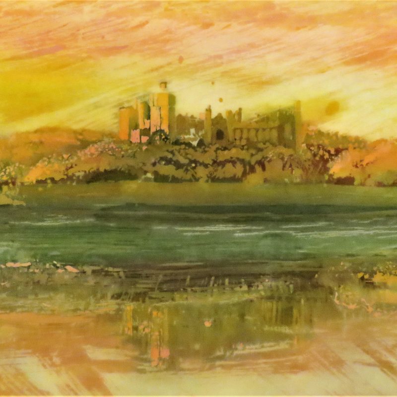  A batik showing Arundel Castle at sunset in the Autumn. Vivid oranges ans yellows.