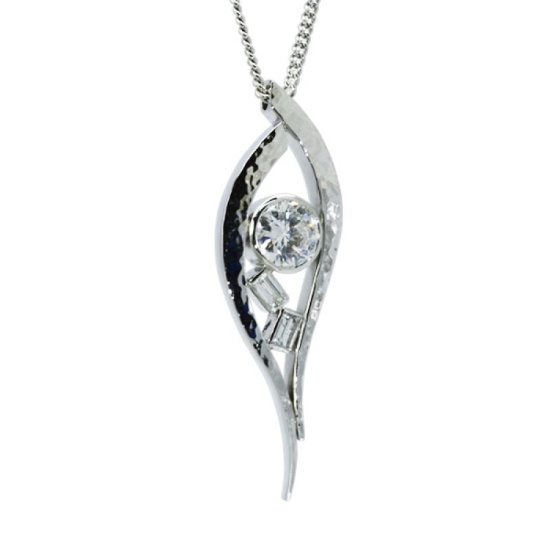 a pendant 60mm long made of two curving bars of hammered platinum set with a 2ct diamond and two baguette diamonds trapped between on an 18 inch curb chain