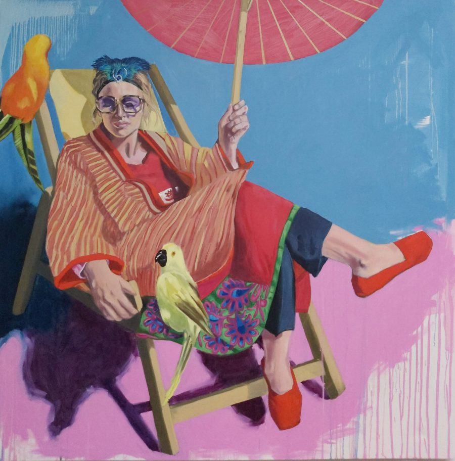 This is a painting of a lady sitting on a deckchair in the sunshine holding an umbrella . The colours are very bright and there are two birds in the painting.It is painted in a realistic style although some areas have sweeping brushstrokes.