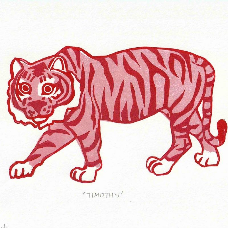 a red and pink tiger printed onto white paper