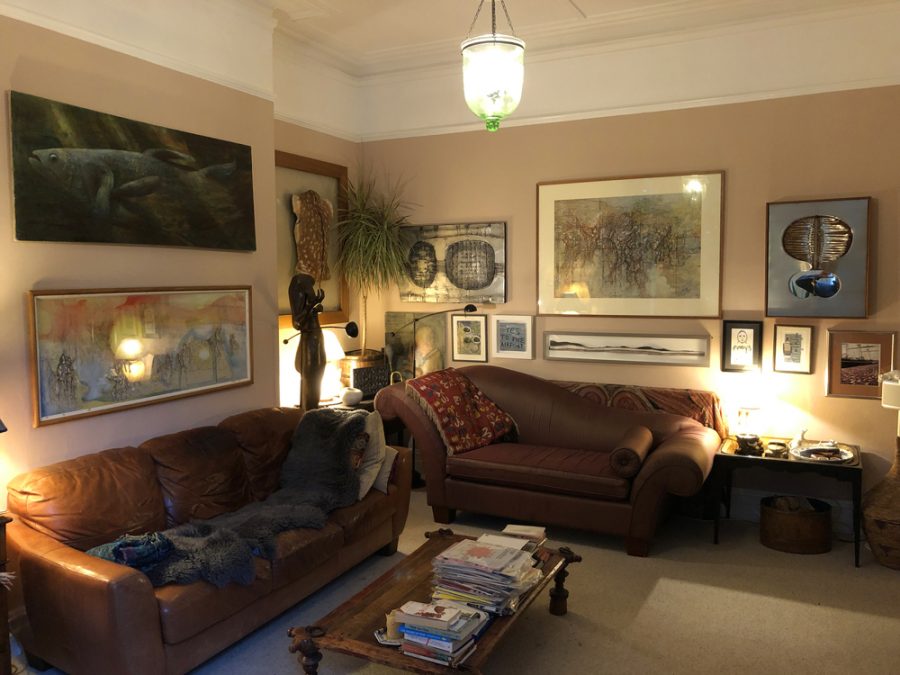 A period living room containing many artworks, antiques and curios