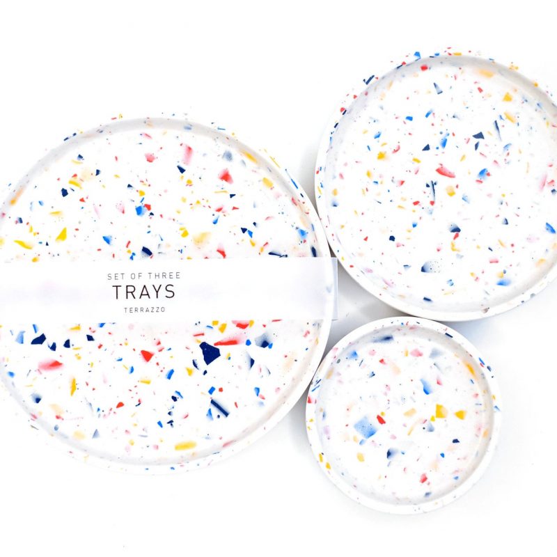 A set of three terrazzo circular trays hand-cast from Jesmonite and vibrantly coloured with specialist pigments.