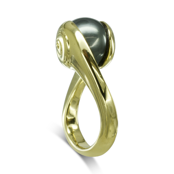 A Suspended Tahitian Pearl Ring handmade in 18ct rose, yellow gold or platinum. The pearl measures 11-12mm and has a green grey lustre and black tone.