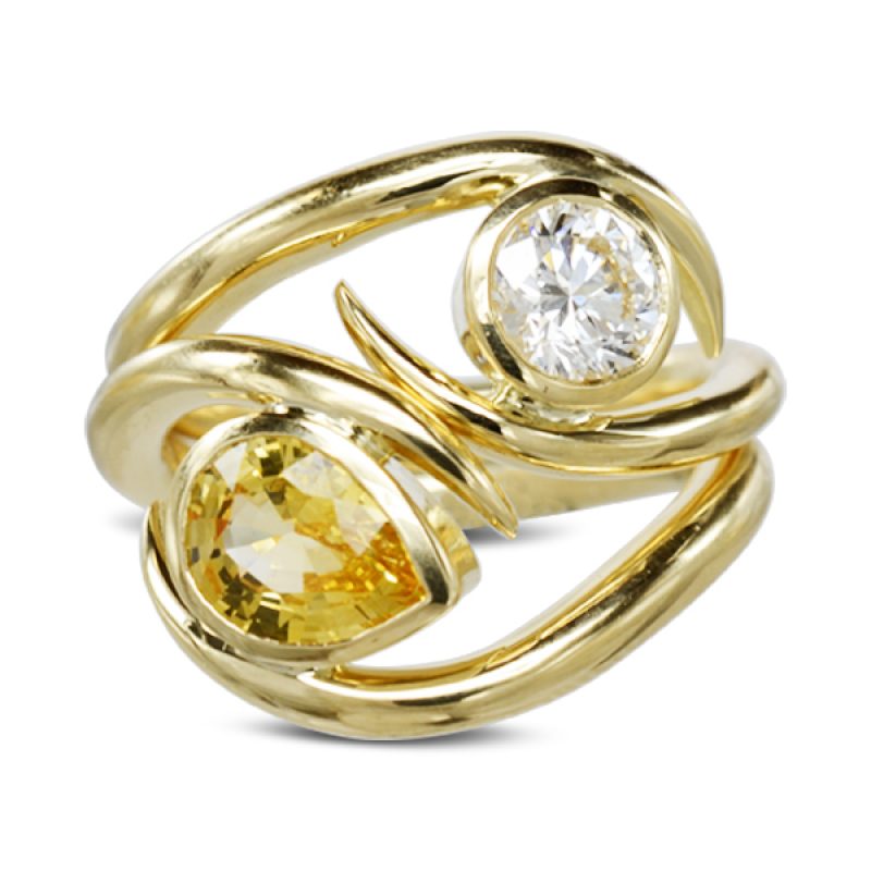 Spiky Yellow Gold Stacking Rings featuring a one carat round brilliant cut diamond and a valuable yellow pear shaped sapphire.