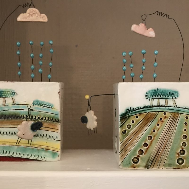 Ceramic boxes with landscape paintings