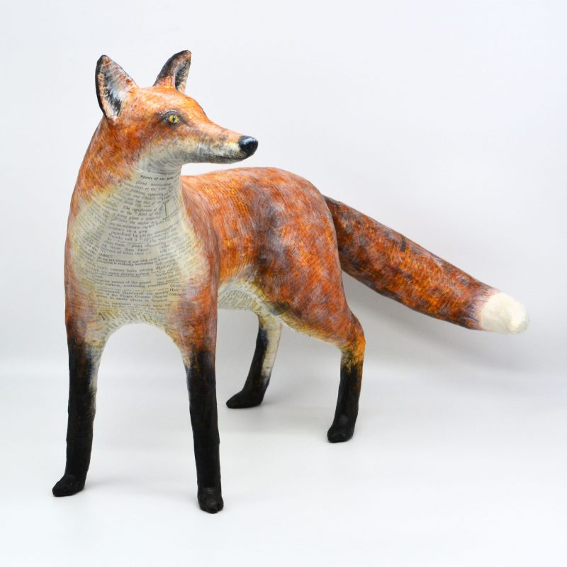 A paper mâché and wire sculpture of a fox