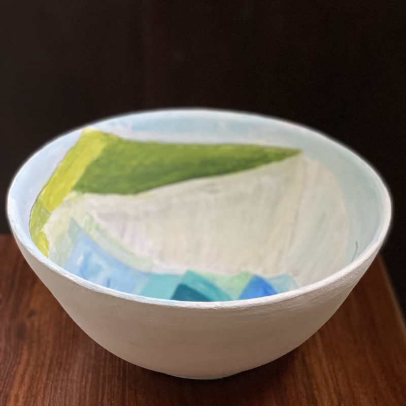 A bowl made in air dry clay with an abstract image of seven sisters