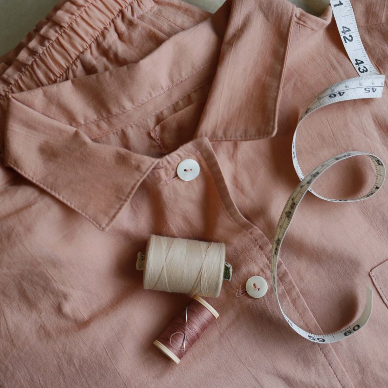 a close up of pyjamas thread and tapemeasure