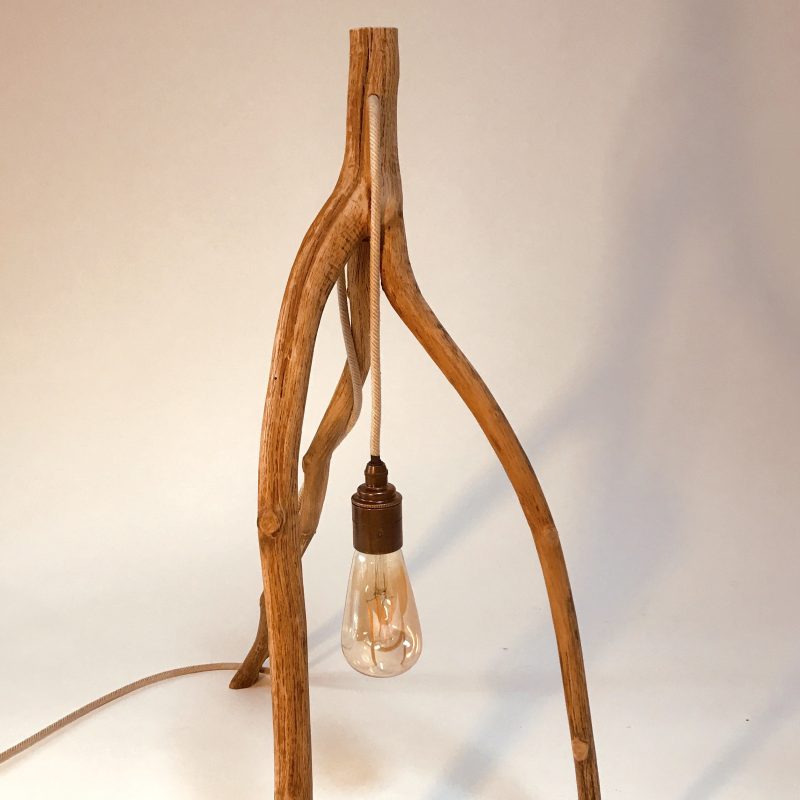 tripod lamp made out of branch wood