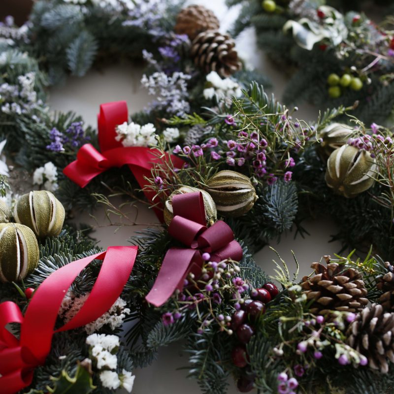 fresh made christmas wreaths with coloured ribbons