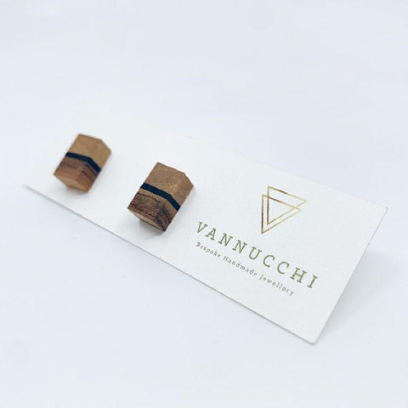 rectangular olive wood studs with dark ebony strip running horizontally through the middle. Displayed on Vannucchi branded card.