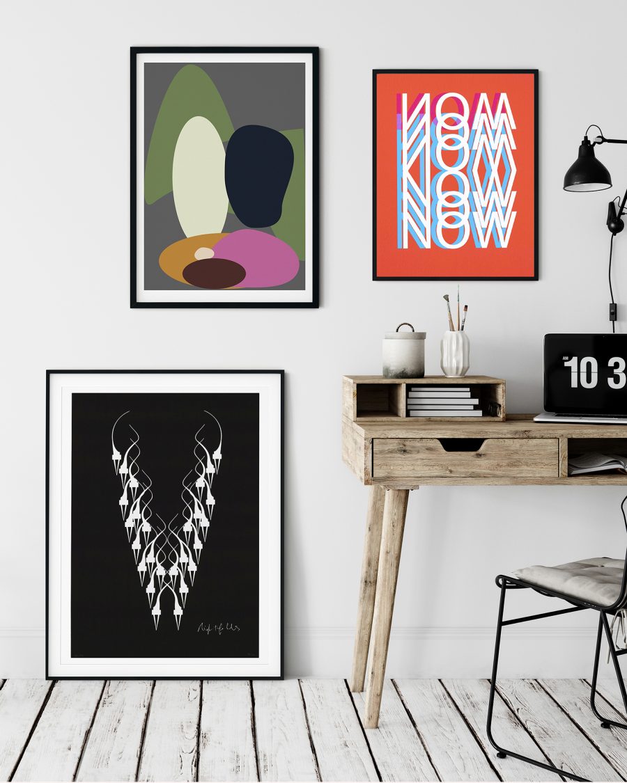 3 colourful framed prints on a gallery wall.