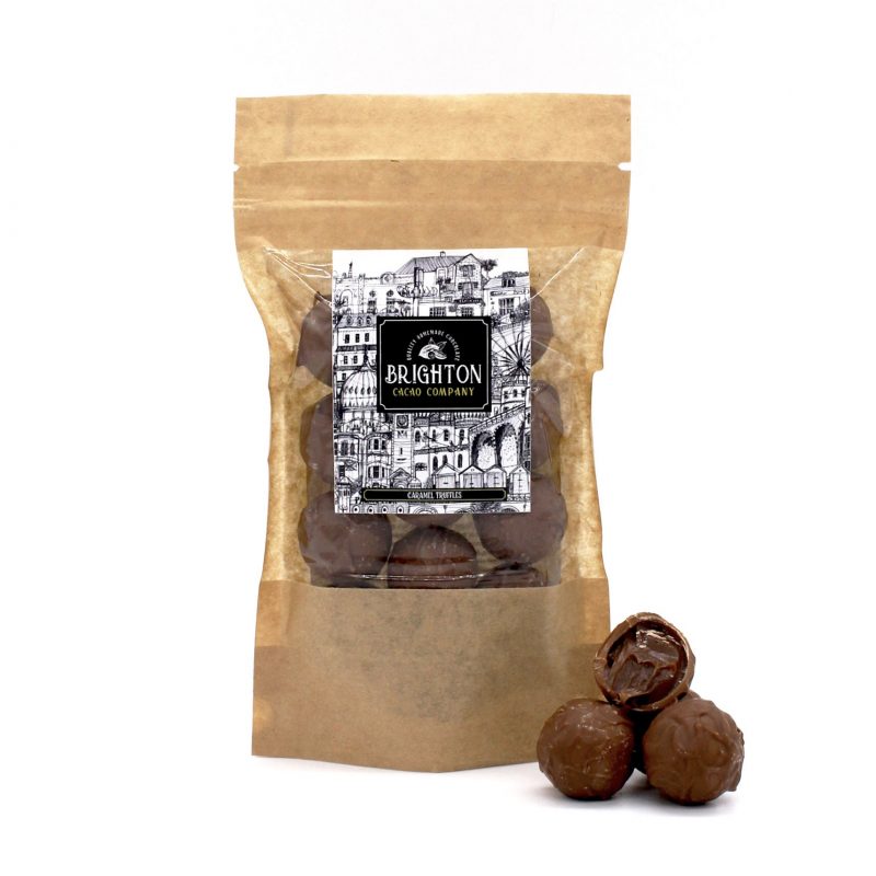 Artisan chocolate truffles in a brown paper bag