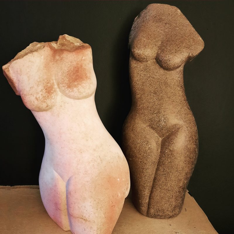 Semi abstract  female torsos carved in stone