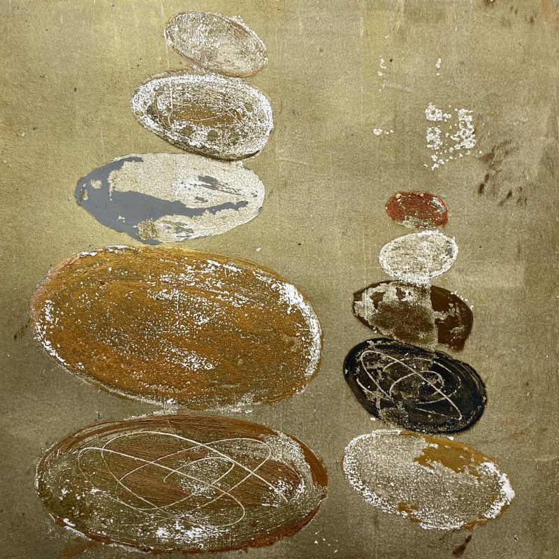 Monotype of Stone stacks on a gold background