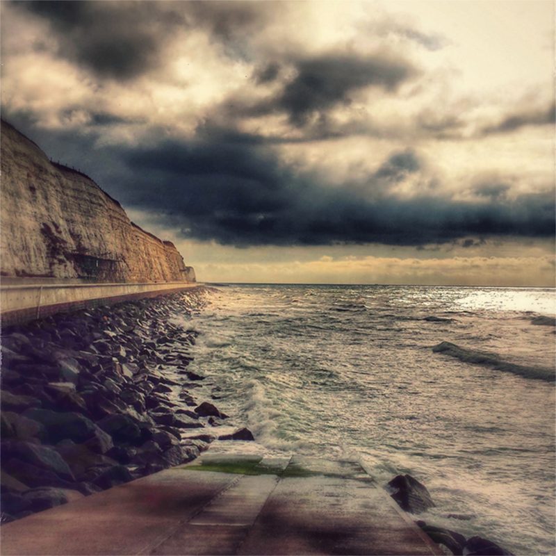 Moody view of Brighton undercliff walk at dusk