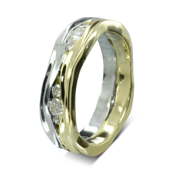 Small round diamonds set between a wavy side hammered band of platinum and a wavy side hammered band of gold
