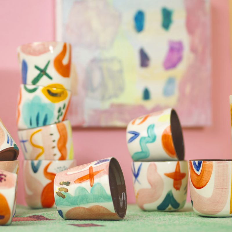 a selection of brightly decorated hand painted tumblers by Becky Blair and Rachel Entwistle