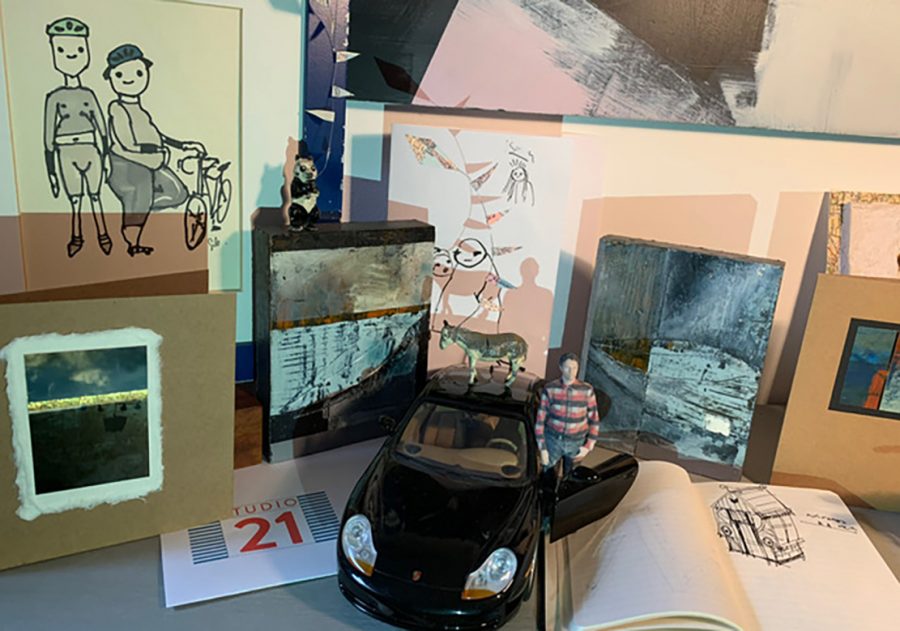 A collection of abstract paintings and objects, including a scale model of Seb, and a design sketch for his installation