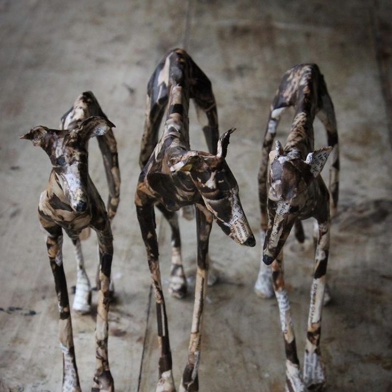 Three dog sculptures