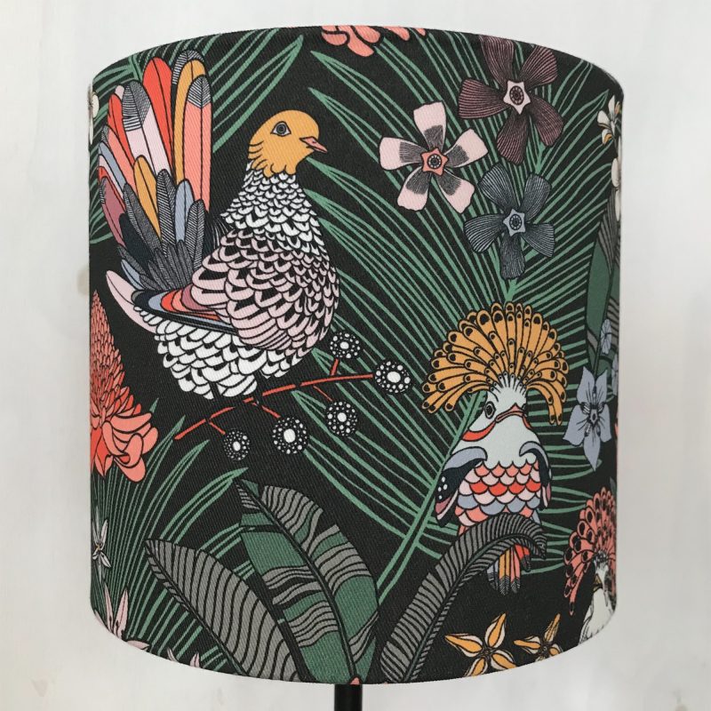 A photograph of a printed lampshade showing a bird and flower motif