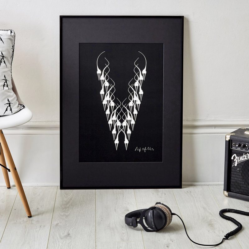 Black Framed art print with white symbols forming the shape of a skull in the centre of the deep black print.