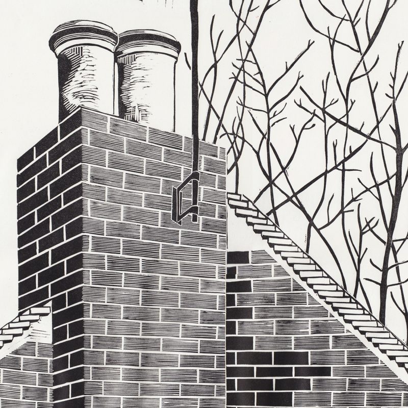 A linocut print of a chimney stack with winter branches behind it