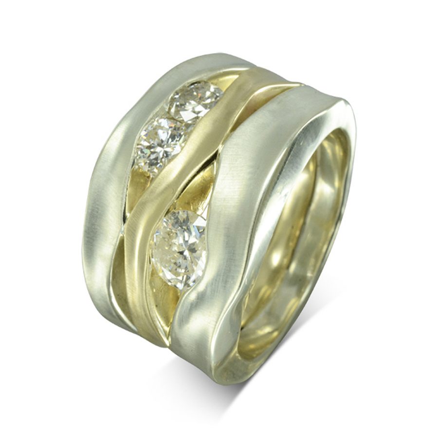 This ring is 15mm wide at the front, comprised of 5mm and 6mm white gold side hammered bands with a 3mm yellow gold centre soldered together and is set with 1ct of round diamonds in between the bands.