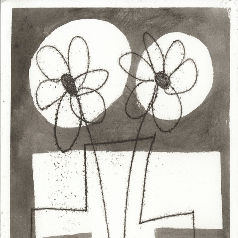 Flowers in vase on grey background with white shapes.