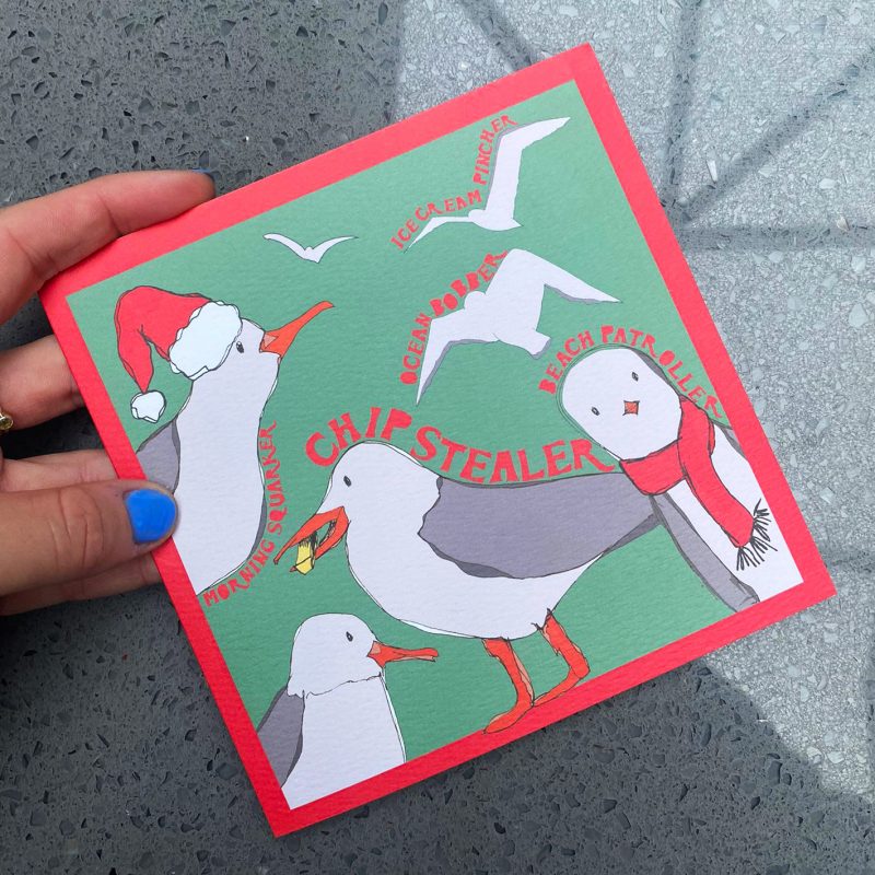 Illustration of seagulls in Santa hats