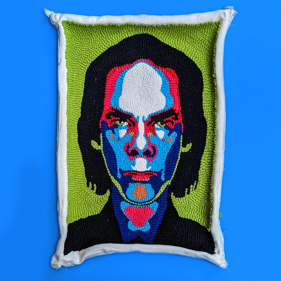 a portrait of the musician Nick Cave in brightly coloured wool