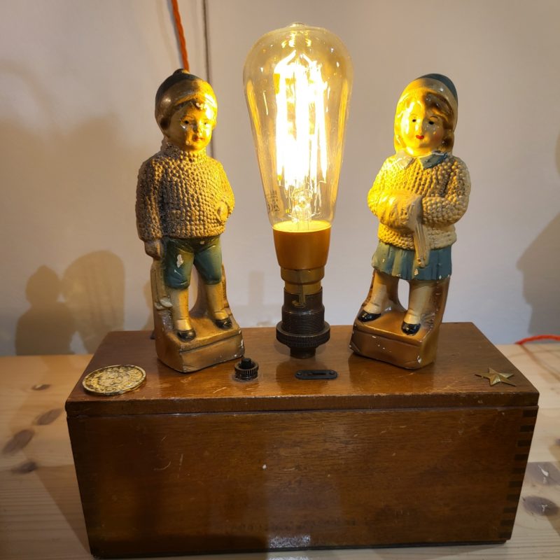 Lamp with vintage figurines on.