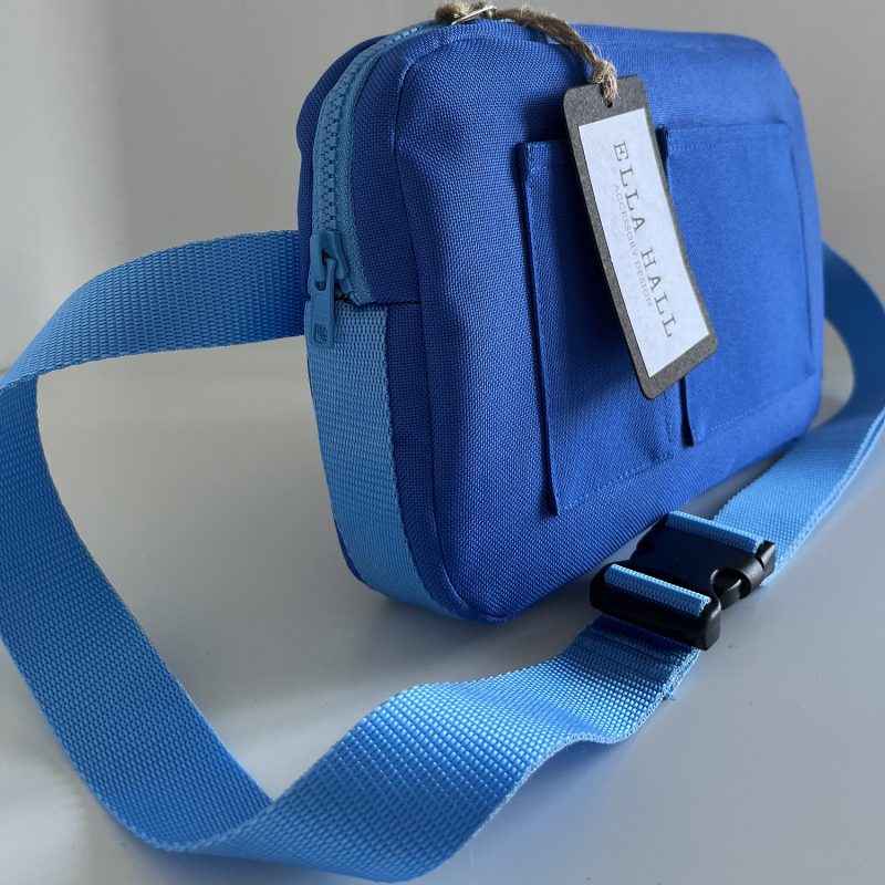 A blue cross-body canvas bag