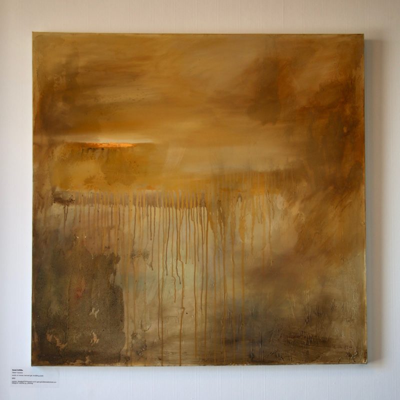 Brilliant gold abstract painting with drips running from top to bottom