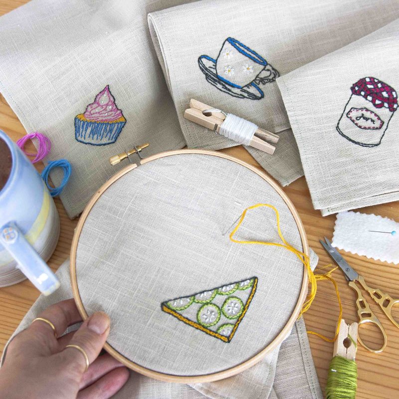 Embroidery hoop with linen fabric showing a hand embroidery kit