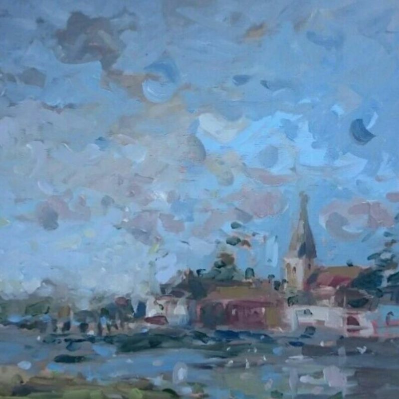 Impressionistic scene of blue water with a bank of trees to the left. On this bank stands a traditional church with steeple standing against a blue and pink sky.