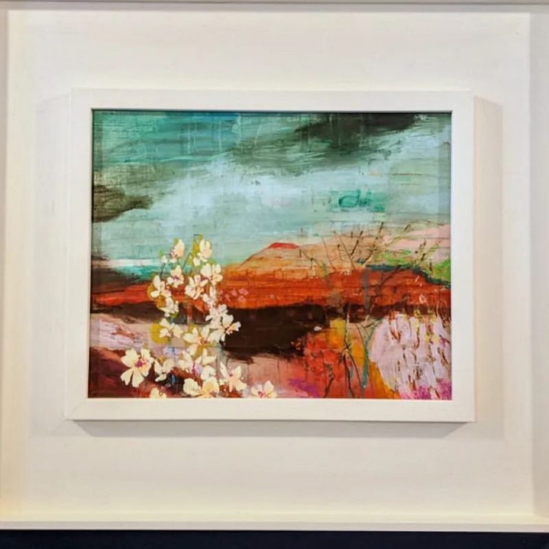 Abstract landscape in blues and pinks with yellowish cream flowers in foreground on left.